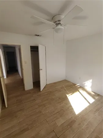 an empty room with a empty space and windows