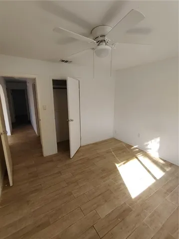 an empty room with a empty space and windows