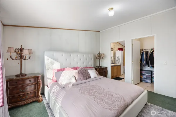 a bathroom with a granite countertop sink a mirror a shower and a bathtub