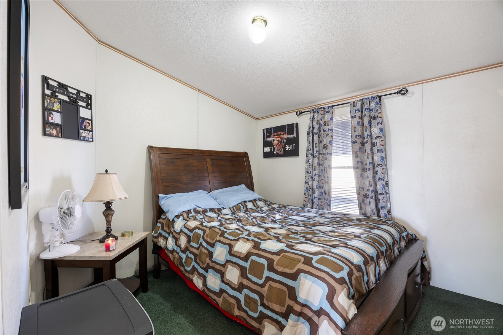 643 Kristina Road Othello, WA 99344 - Photo 19 of 33 a bedroom with a bed and a table in it