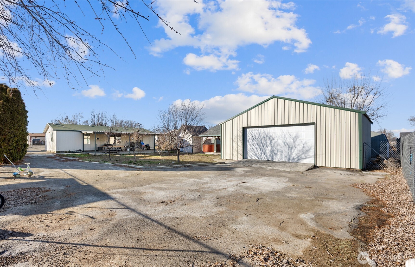 643 Kristina Road Othello, WA 99344 - Photo 24 of 33 a view of a house with a yard