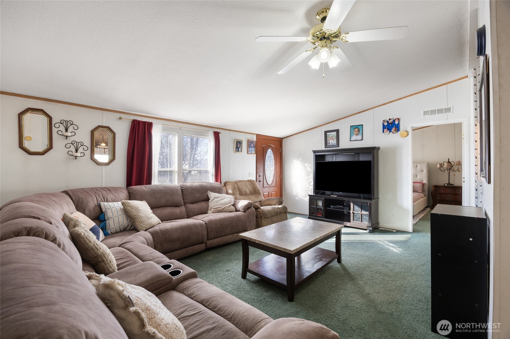 643 Kristina Road Othello, WA 99344 - Photo 7 of 33 a living room with furniture and a flat screen tv