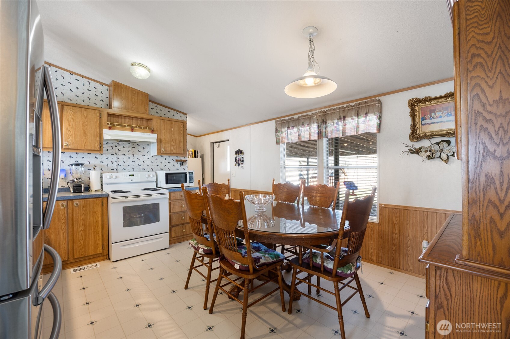 643 Kristina Road Othello, WA 99344 - Photo 8 of 33 a view of a dining room with furniture and wooden floor