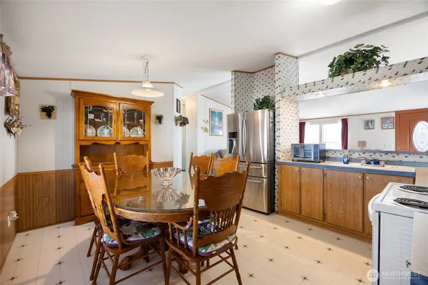 a kitchen with stainless steel appliances a stove a sink and a refrigerator
