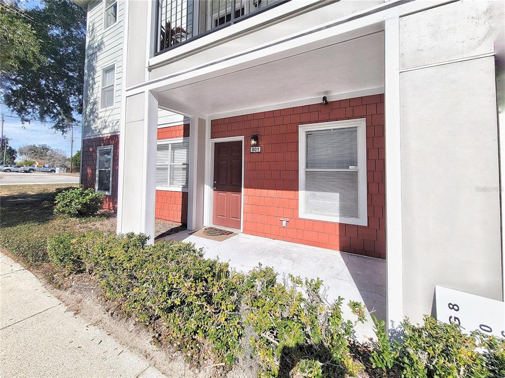 2360 Southwest Archer Road, Unit 801 Gainesville, FL 32608 - Photo 3 of 27 a front view of a house with a yard