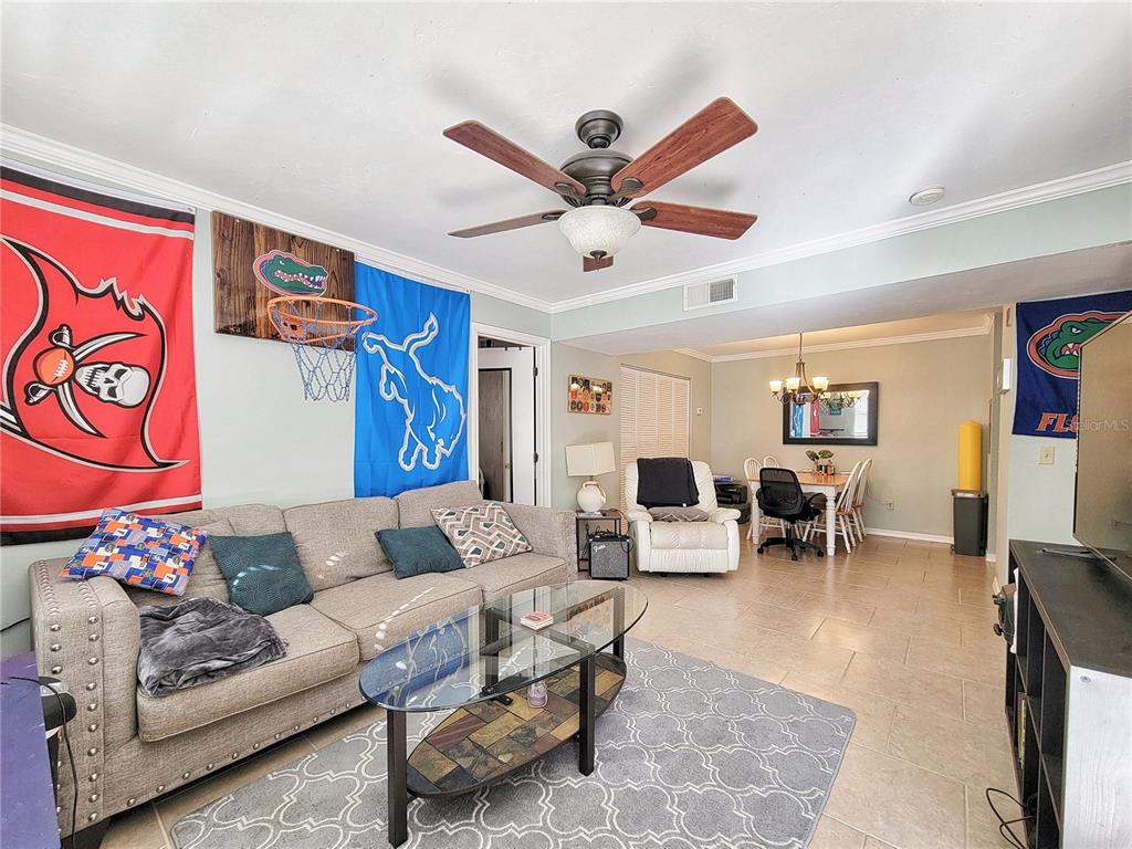 2360 Southwest Archer Road, Unit 801 Gainesville, FL 32608 - Photo 6 of 27 a living room with furniture and a large window