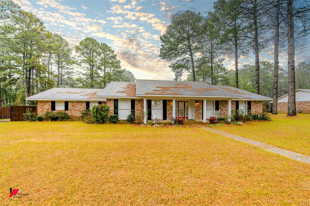 1002 North Acres Lane Springhill, LA 71075 - Photo 1 of 1 Single story home featuring a porch and a lawn