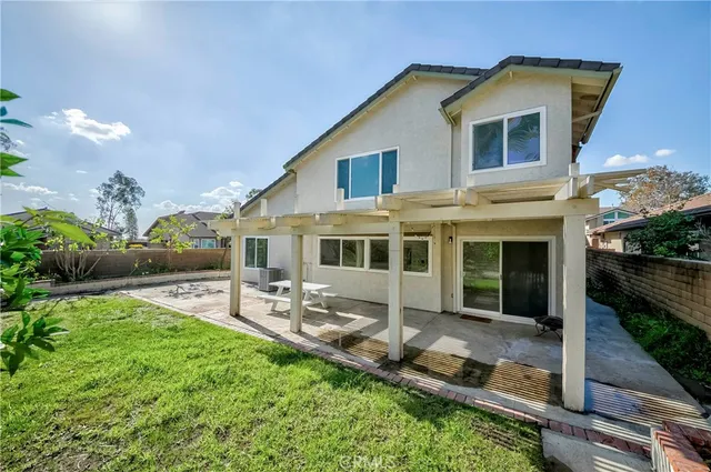a front view of house with yard and outdoor seating
