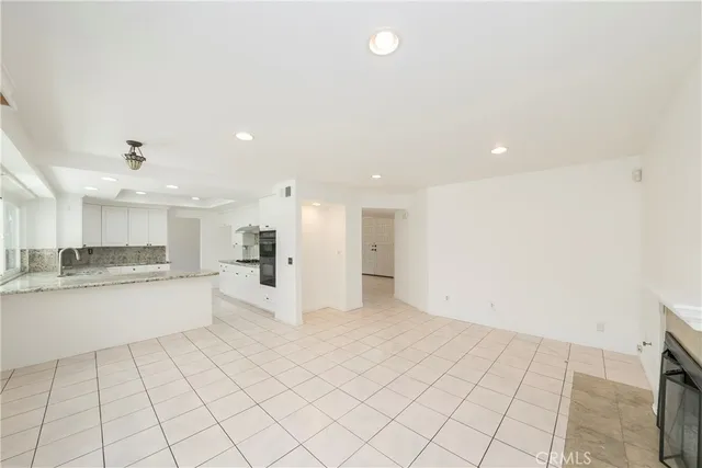 a view of kitchen with center island and stainless steel appliances