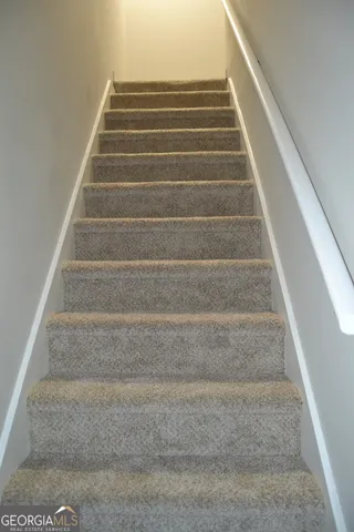 a white toilet sitting next to a bath tub and a shower