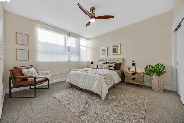 a bedroom with a bed and a couch