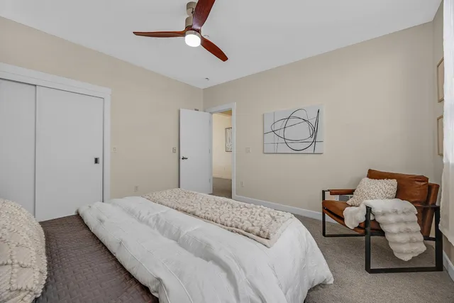 a bedroom with bed and window