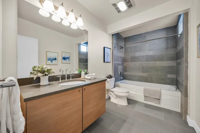 a bathroom with a toilet a sink and a bathtub