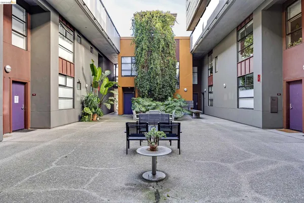 a lobby with furniture and potted plant