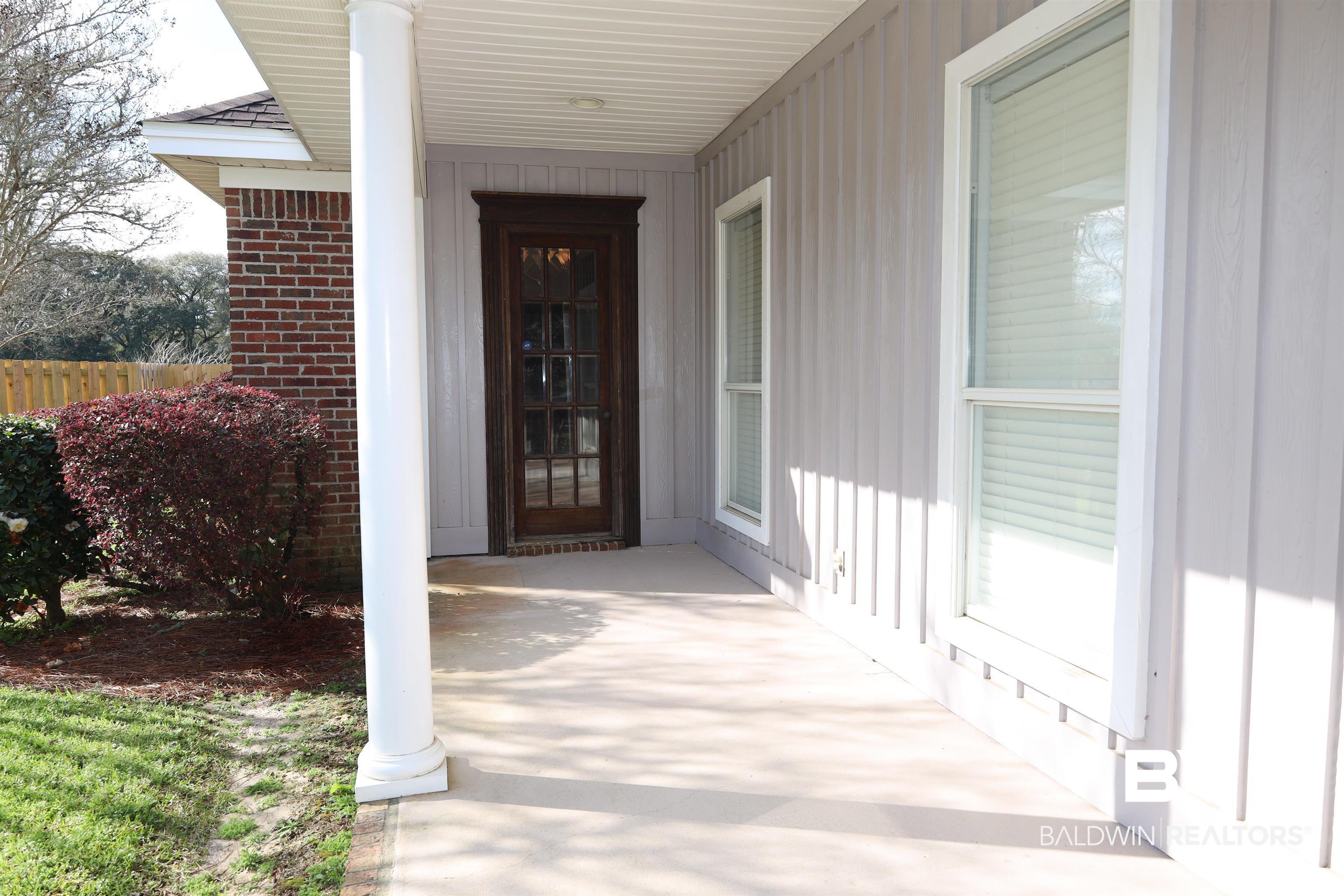 111 Destrehan Road Fairhope, AL 36532 - Photo 25 of 29 Entrance to property with brick siding and board and batten siding