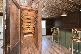 a kitchen with a sink dishwasher a stove and a refrigerator with wooden floor