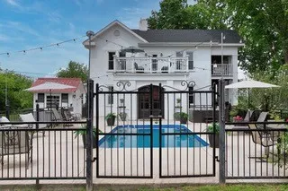 a view of a chairs and table in the patio