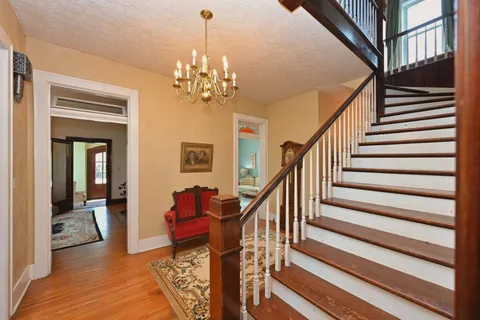 a bathroom with a shower a mirror and a sink