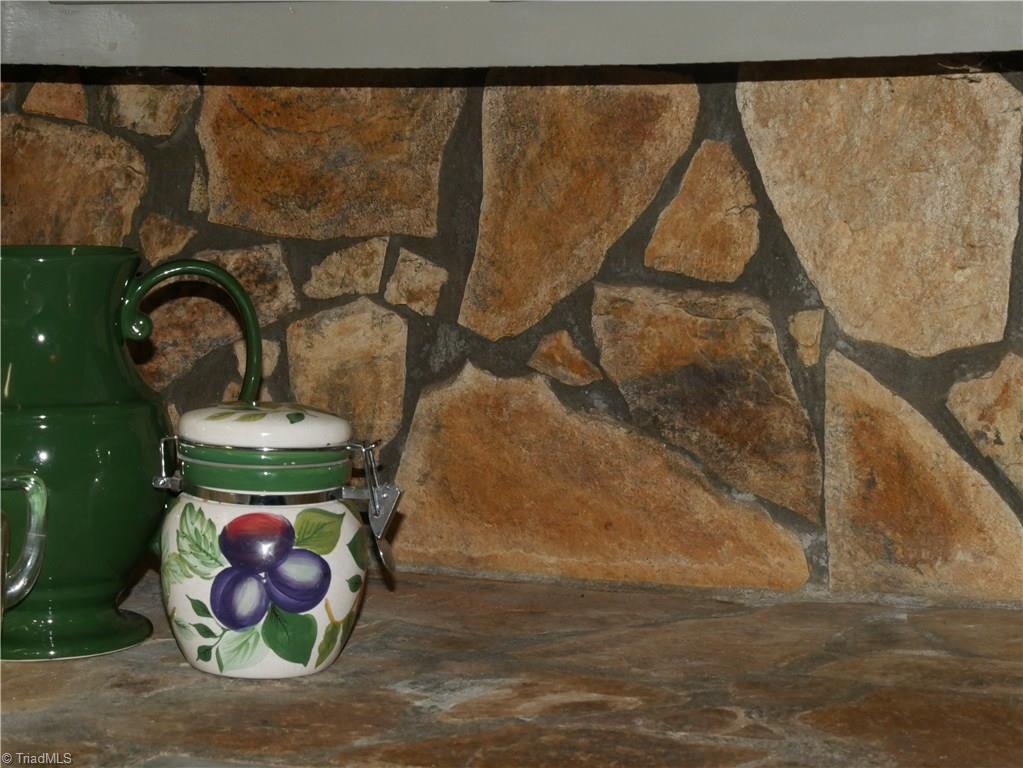 1676 Ray Loop Road Westfield, NC 27053 - Photo 12 of 25 Stone backsplash and countertop