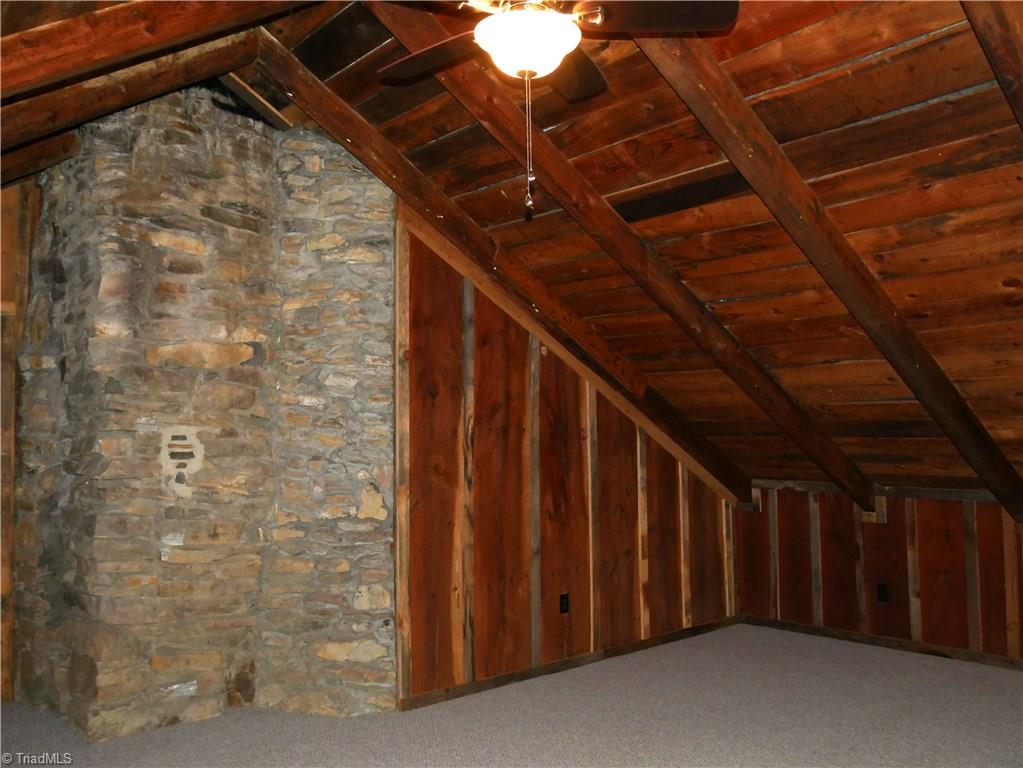1676 Ray Loop Road Westfield, NC 27053 - Photo 16 of 25 other wall of attic room with outside entrance