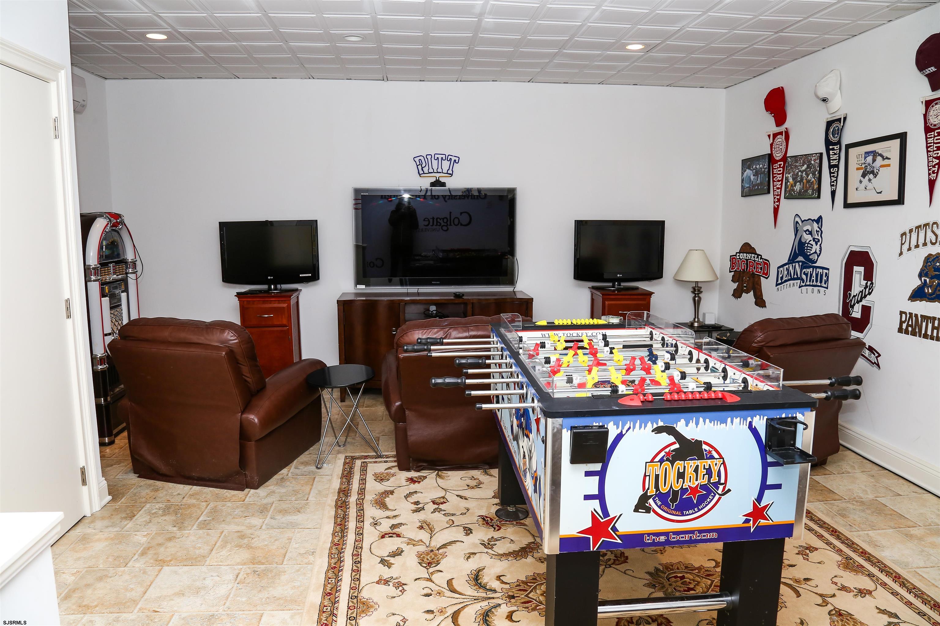 339 South 13th Street Brigantine, NJ 08203 - Photo 12 of 57 a living room with furniture and a flat screen tv