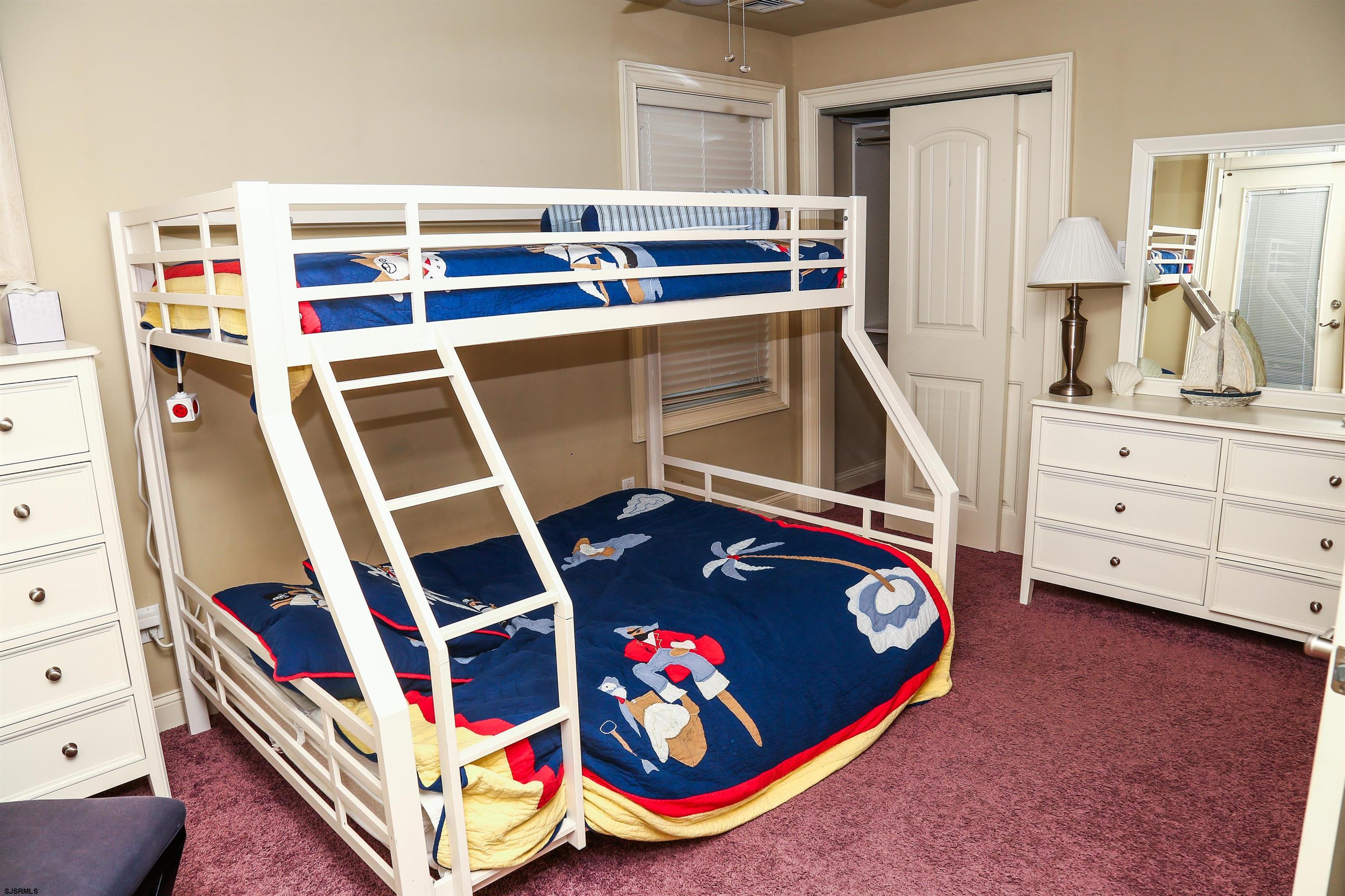 339 South 13th Street Brigantine, NJ 08203 - Photo 17 of 57 a bedroom with a bed and a dresser