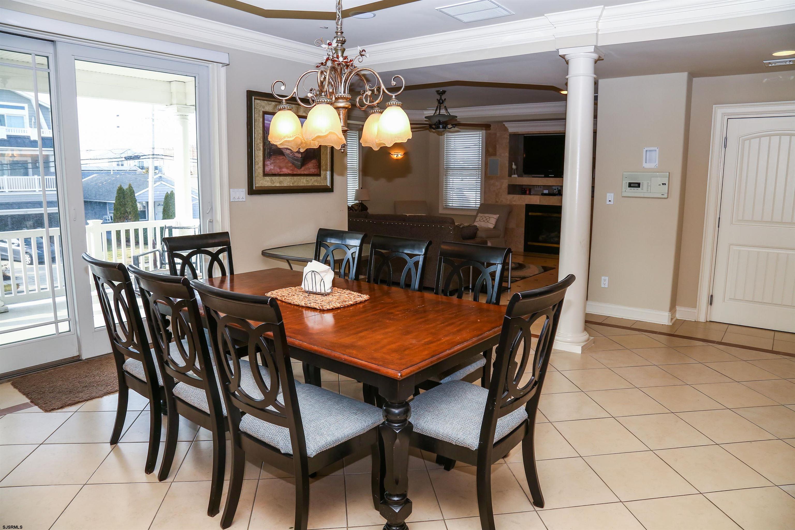 339 South 13th Street Brigantine, NJ 08203 - Photo 25 of 57 a view of a dining room with furniture and chandelier