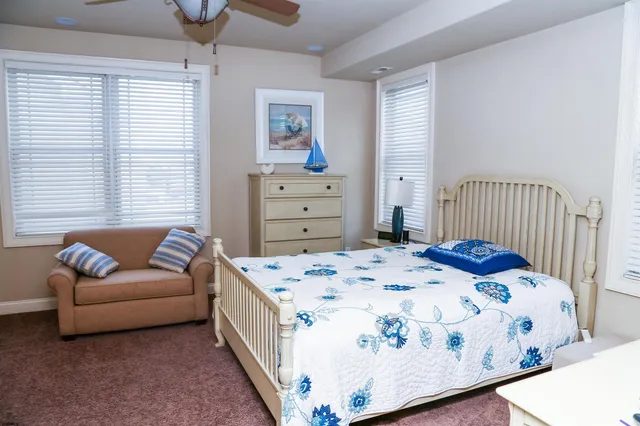 a bedroom with a large bed and a dresser