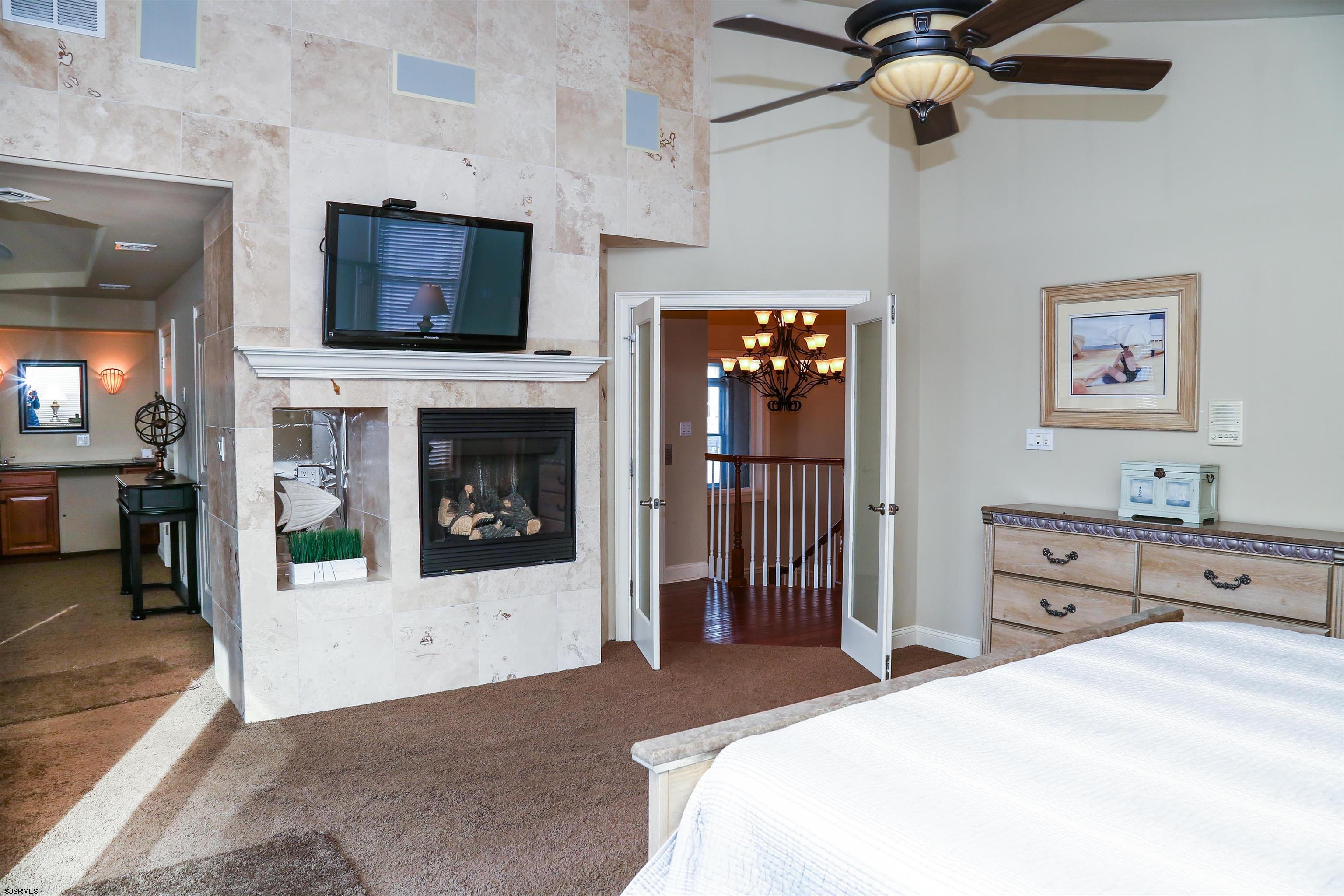 339 South 13th Street Brigantine, NJ 08203 - Photo 45 of 57 a bedroom with a bed and a television