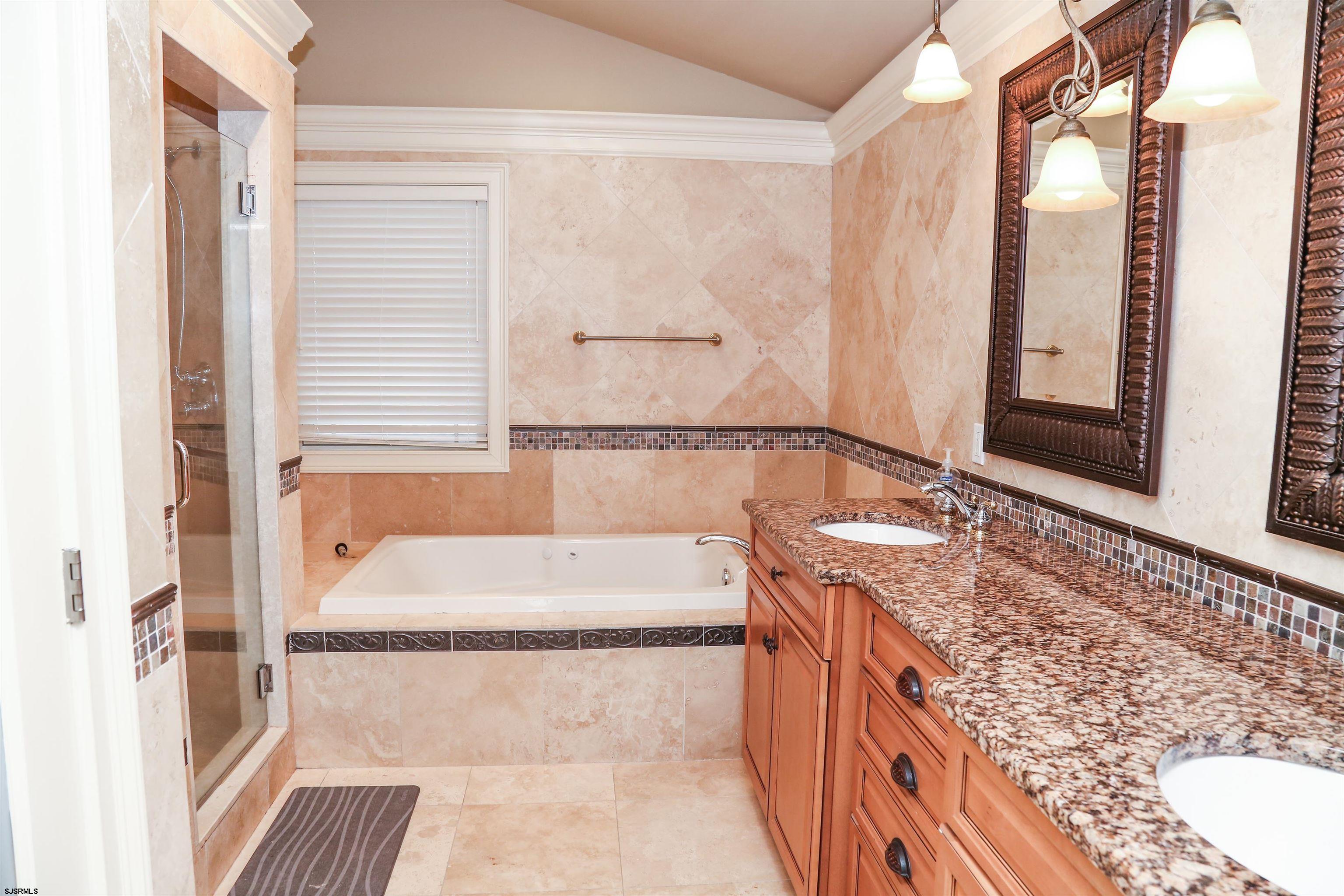 339 South 13th Street Brigantine, NJ 08203 - Photo 48 of 57 a bathroom with a bathtub and a sink