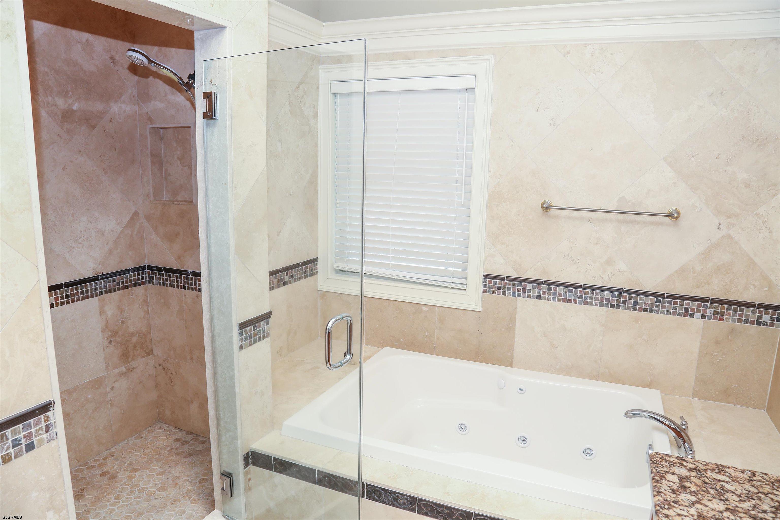 339 South 13th Street Brigantine, NJ 08203 - Photo 49 of 57 a bathroom with a bathtub and a shower