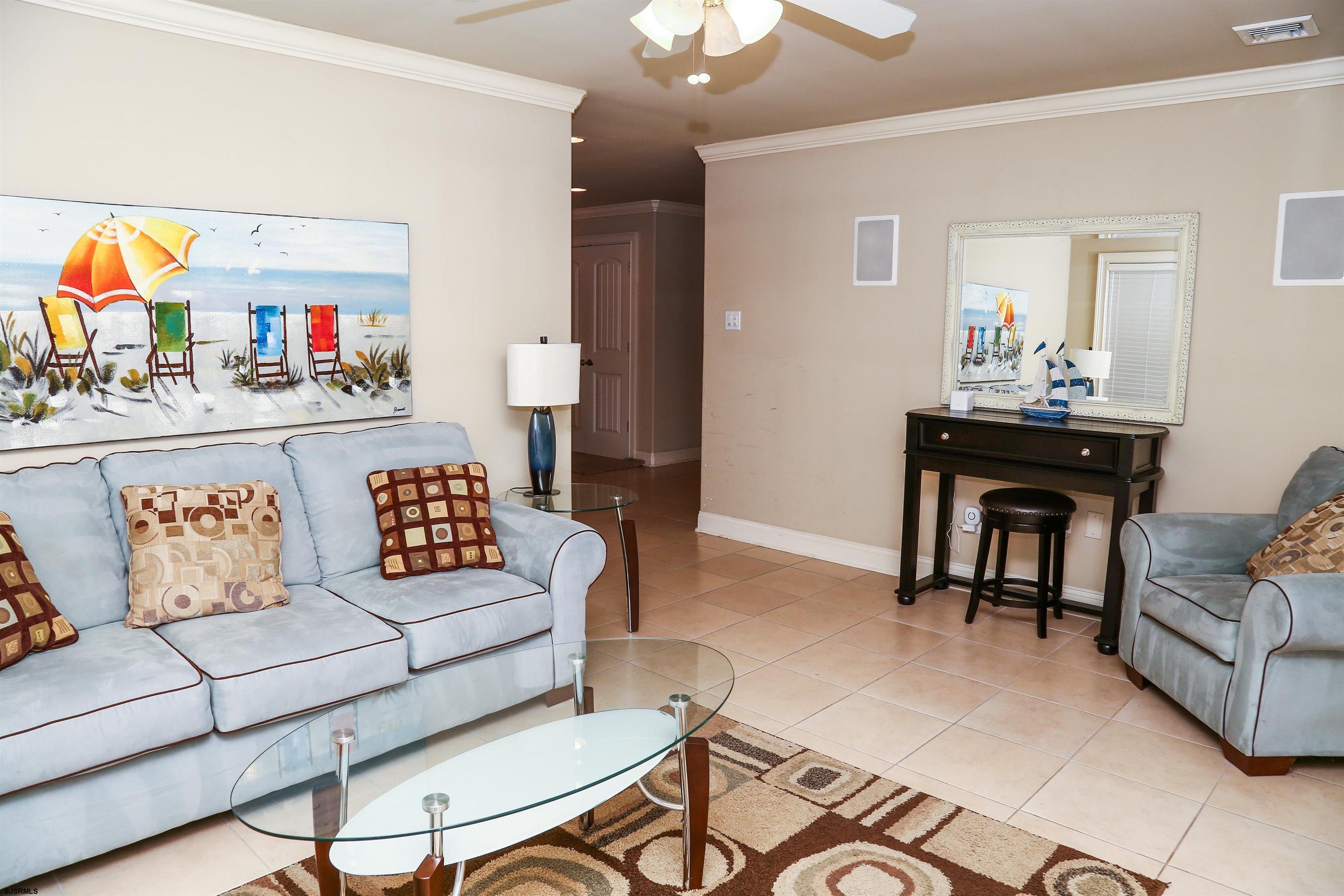 339 South 13th Street Brigantine, NJ 08203 - Photo 6 of 57 a living room with furniture and a flat screen tv