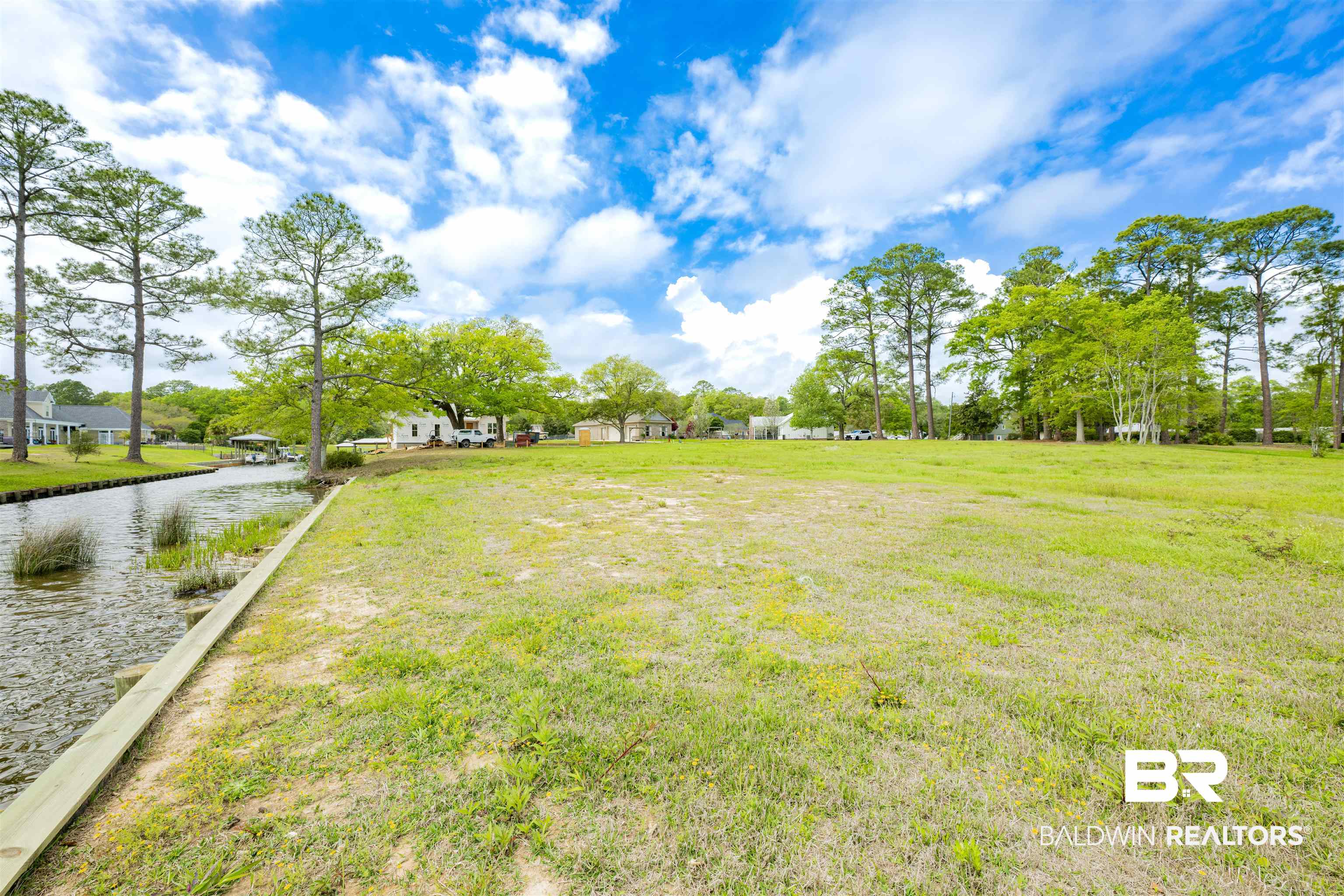 0 South Windsor Road South Theodore, AL 36582 - Photo 18 of 22 View of green lawn featuring a water view