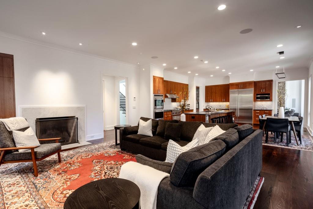 4036 Conway Valley Road Northwest Atlanta, GA 30327 - Photo 11 of 26 a living room with furniture kitchen view and a fireplace