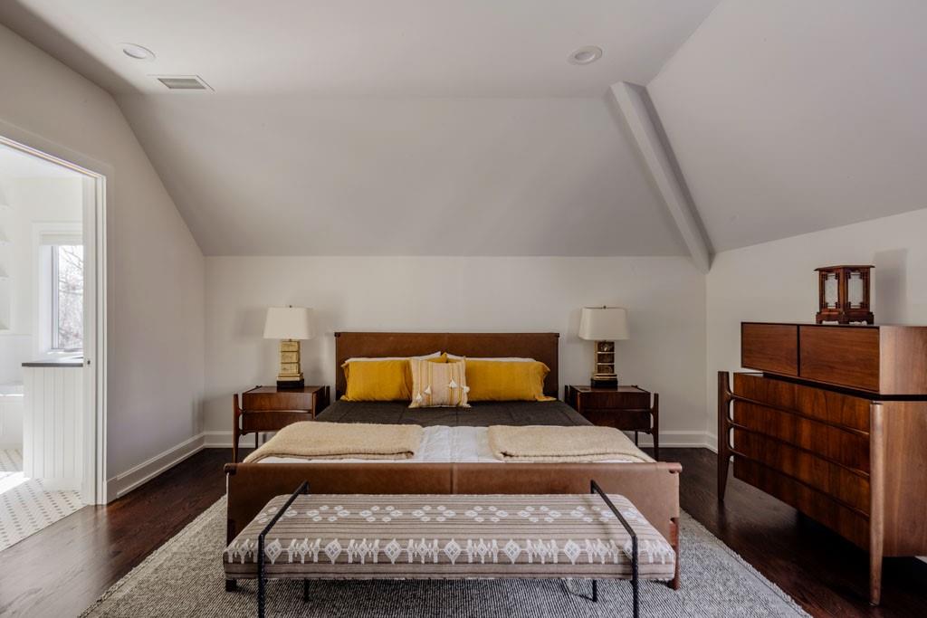 4036 Conway Valley Road Northwest Atlanta, GA 30327 - Photo 17 of 26 a bedroom with a bed and wooden floor