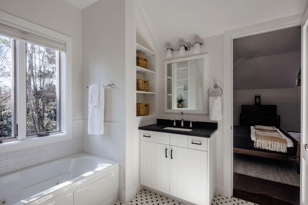 4036 Conway Valley Road Northwest Atlanta, GA 30327 - Photo 19 of 26 a bedroom with a bed and a window