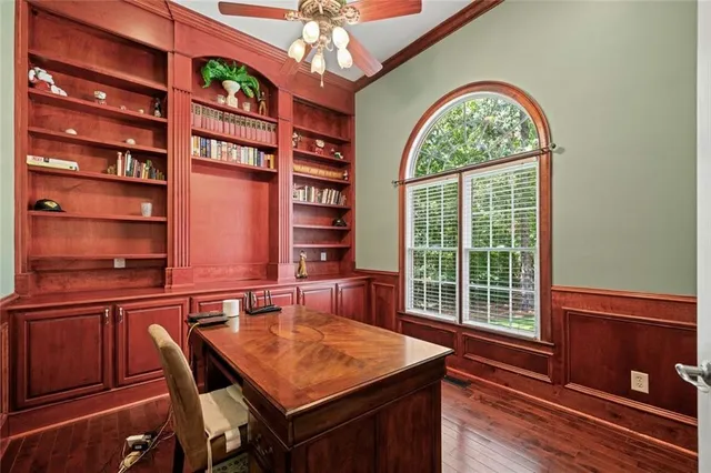 a view of a room that has a window and a chandelier