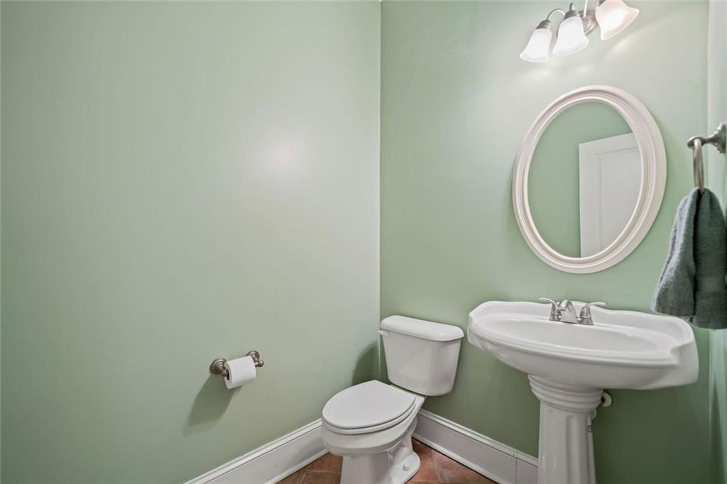 106 Shalea Lane Ball Ground, GA 30107 - Photo 22 of 52 a bathroom with a sink and a mirror