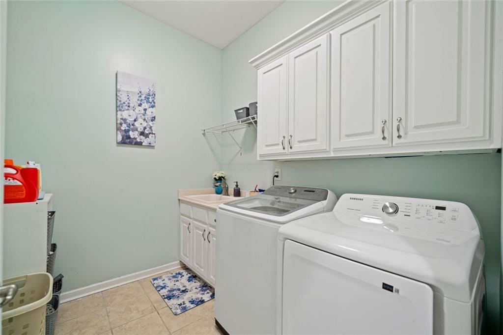 106 Shalea Lane Ball Ground, GA 30107 - Photo 23 of 52 a utility room with dryer and washer