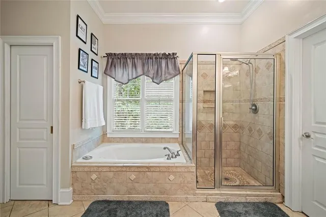 a spacious bathroom with a sink and a mirror