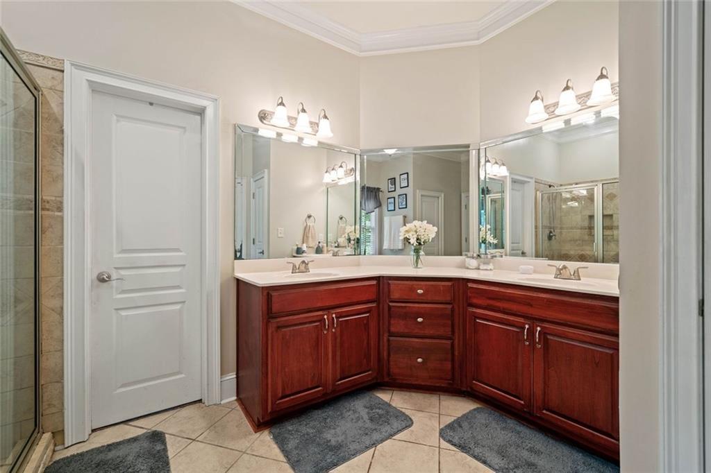 106 Shalea Lane Ball Ground, GA 30107 - Photo 28 of 52 a spacious bathroom with a sink and a mirror