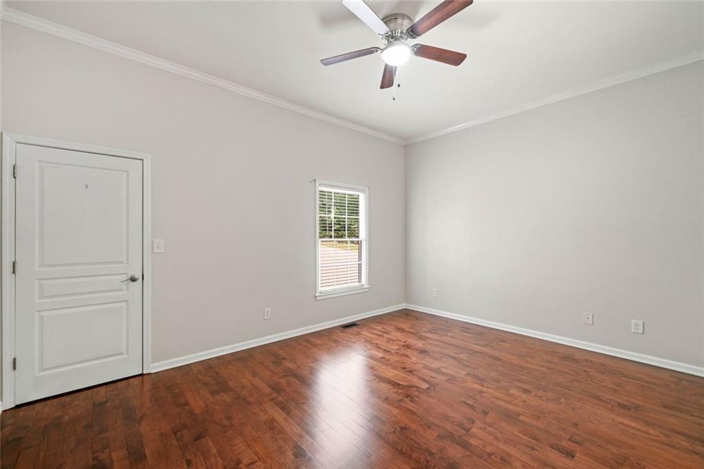 106 Shalea Lane Ball Ground, GA 30107 - Photo 33 of 52 a view of empty room with wooden floor and fan