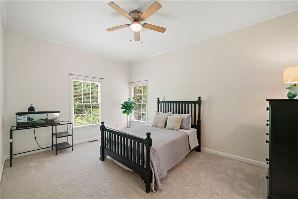 106 Shalea Lane Ball Ground, GA 30107 - Photo 35 of 52 a bed room with a bed and a window