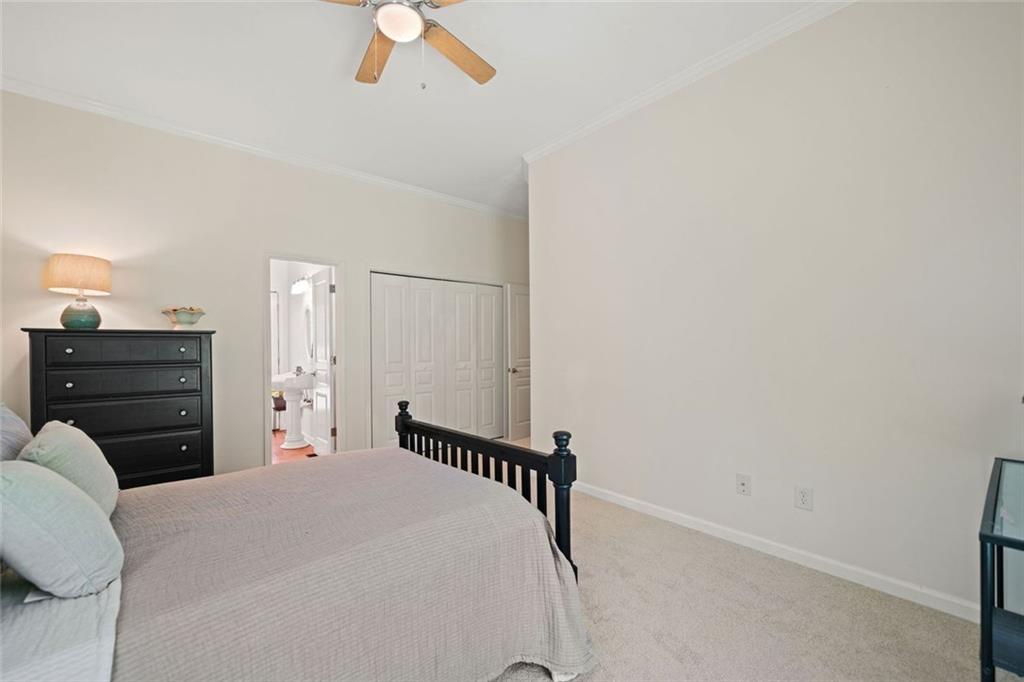 106 Shalea Lane Ball Ground, GA 30107 - Photo 36 of 52 a bedroom with a bed and a dresser