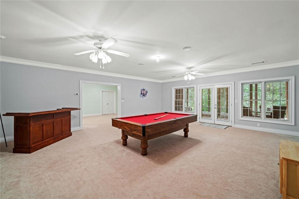 106 Shalea Lane Ball Ground, GA 30107 - Photo 45 of 52 a living room with furniture and windows