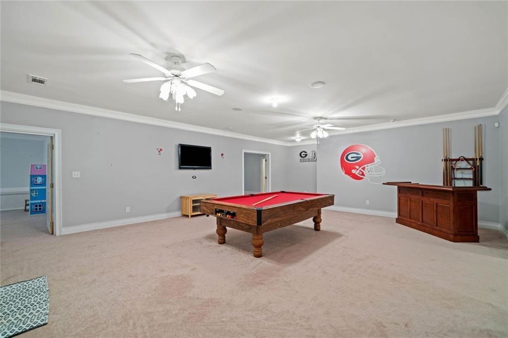 106 Shalea Lane Ball Ground, GA 30107 - Photo 47 of 52 a living room with furniture and a flat screen tv