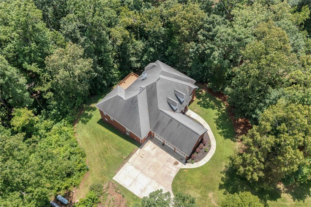 106 Shalea Lane Ball Ground, GA 30107 - Photo 5 of 52 an aerial view of a house with outdoor space and trees all around