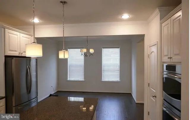 a view of kitchen and windows