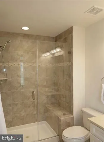 a view of a hallway with wooden shelves