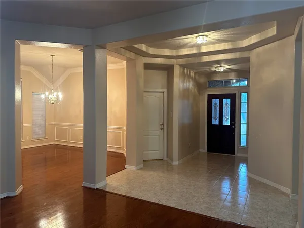 a view of gallery with wooden floor